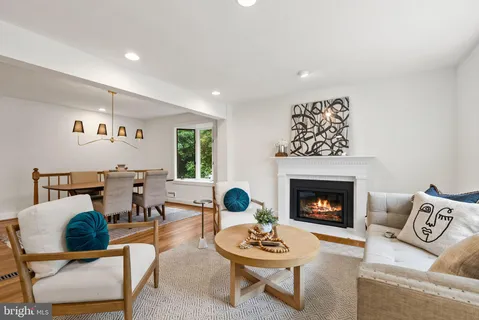 a kitchen with stainless steel appliances granite countertop a refrigerator a stove and a sink