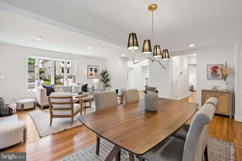 a view of a dining room with furniture water view and a garden