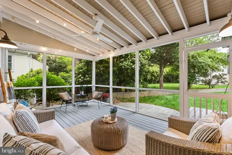 a outdoor living space with furniture and rug