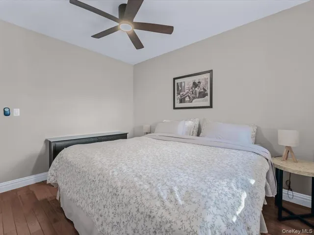 a bedroom with bed and window