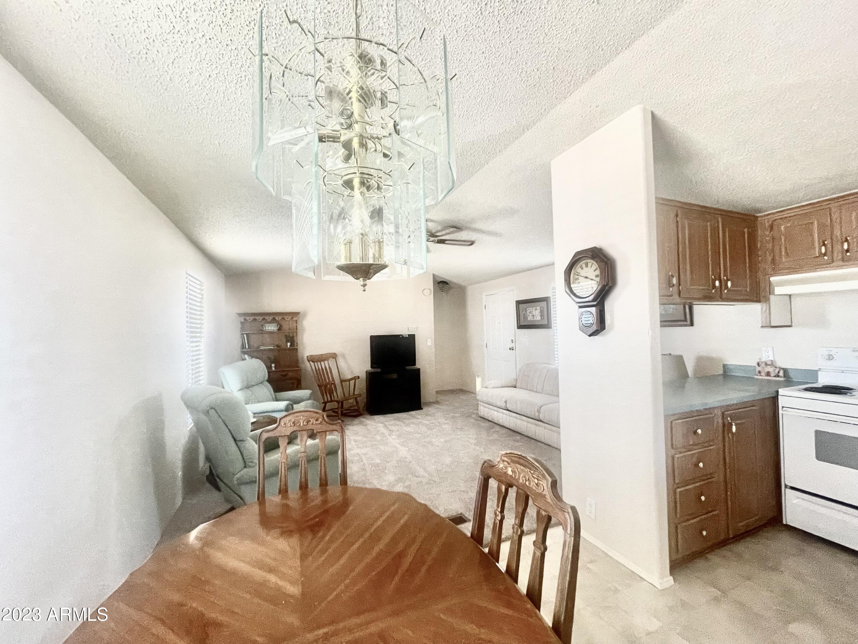 652 South Ellsworth Road, Unit 18 Mesa, AZ 85208 - Photo 3 of 24 18NEWCARPETKITCHENLIVING
