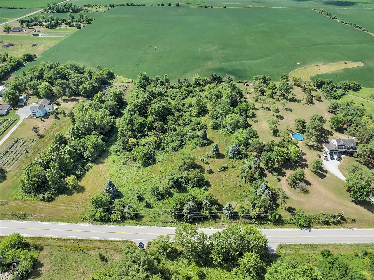 0 West Indiana Avenue Beecher, IL 60401 - Photo 2 of 13 an aerial view of a house with a yard