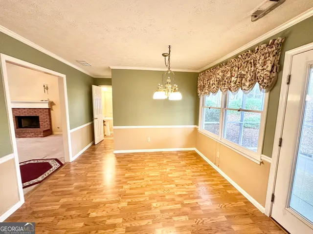 a kitchen with stainless steel appliances kitchen island granite countertop a refrigerator and stove top oven