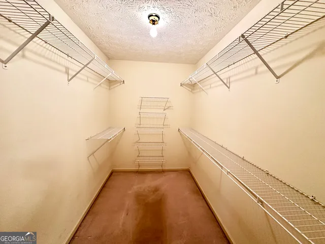 a bathroom with a double vanity sink and mirror