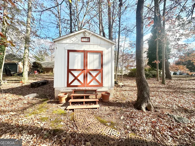 a bench sitting in the middle of a yard