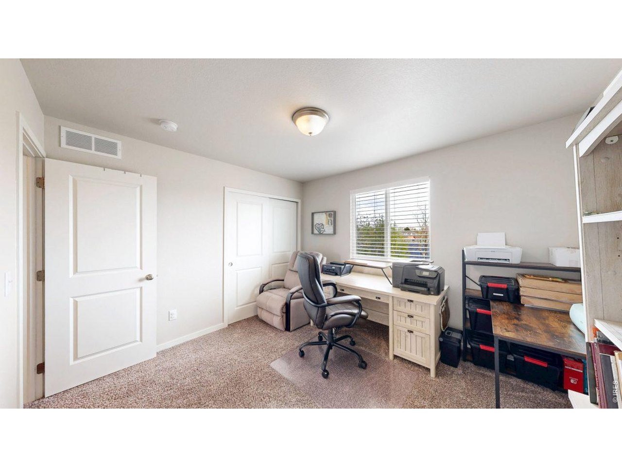 620 Cimarron Trail Ault, CO 80610 - Photo 23 of 37 a living room with furniture and a large window
