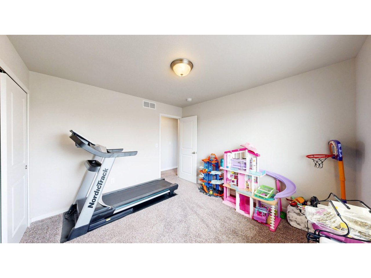 620 Cimarron Trail Ault, CO 80610 - Photo 24 of 37 a room with gym equipment
