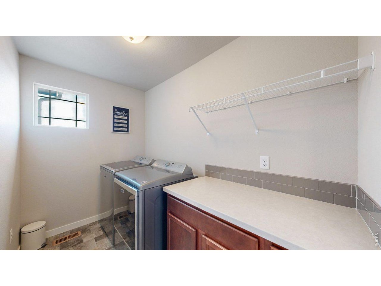 620 Cimarron Trail Ault, CO 80610 - Photo 27 of 37 a kitchen with a cabinets and sink