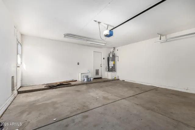 a view of a livingroom with a ceiling fan and window