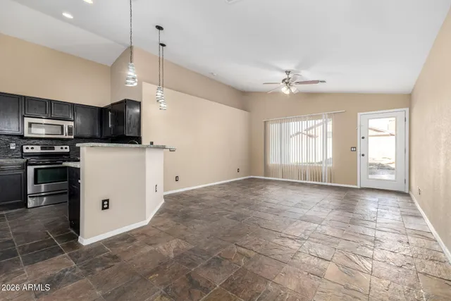 a view of a kitchen with a sink and microwave