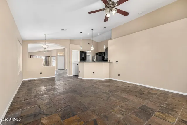 a view of a kitchen with a sink and a window