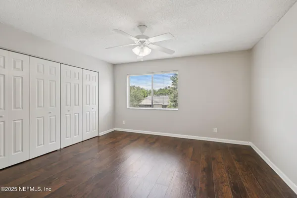 a bathroom with a sink vanity and a mirror
