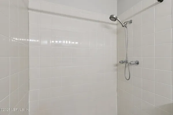 a bathroom with a double vanity sink mirror and toilet
