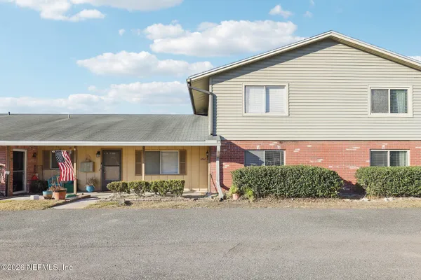 a living room with furniture and stairs