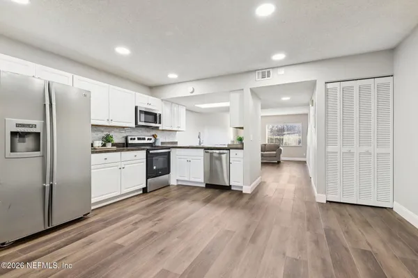 a bathroom with a sink a vanity and a mirror