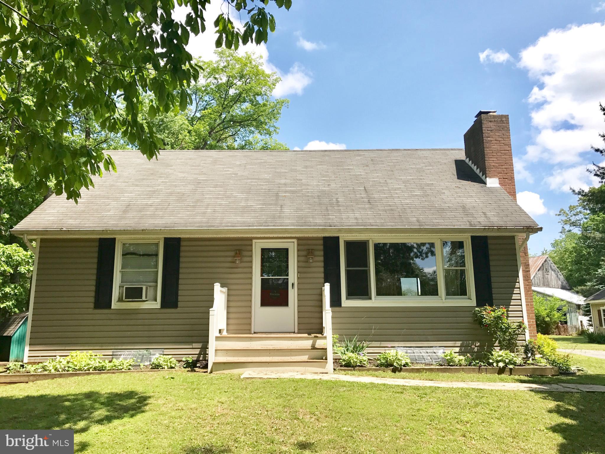 16005 Dark Hollow Road Upperco, MD 21155 - Photo 1 of 17 a front view of a house with a yard