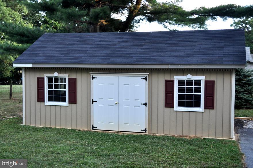 16005 Dark Hollow Road Upperco, MD 21155 - Photo 4 of 17 a view of a house with a small yard and large tree