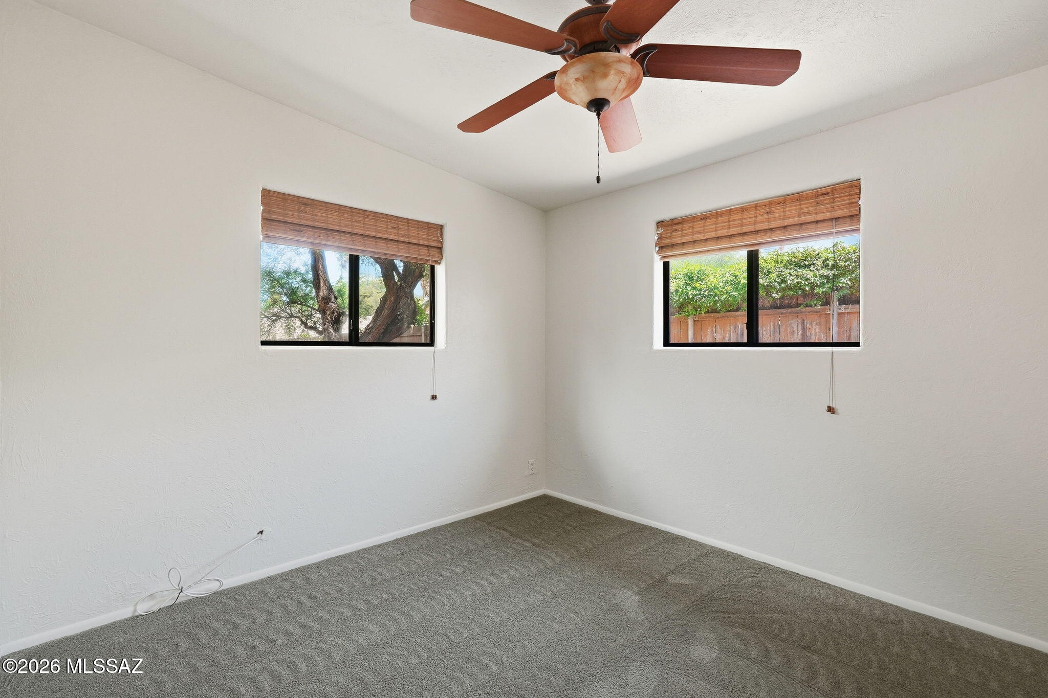 1125 East Kleindale Road Tucson, AZ 85719 - Photo 21 of 49 an empty room with windows and fan