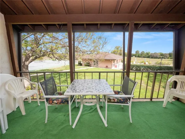 a table and chairs in front of a house