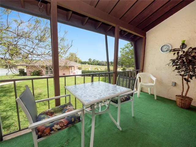 a patio with table and chairs