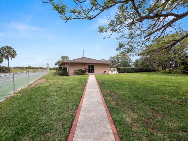 a sign that is sitting on a brick wall