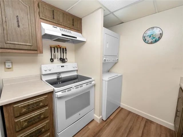 a kitchen with a stove and a microwave