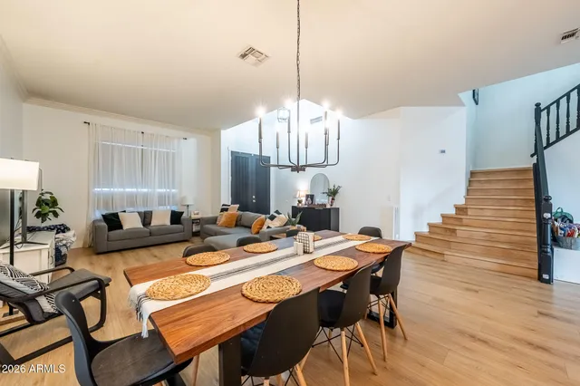 a living room with furniture a rug and a window