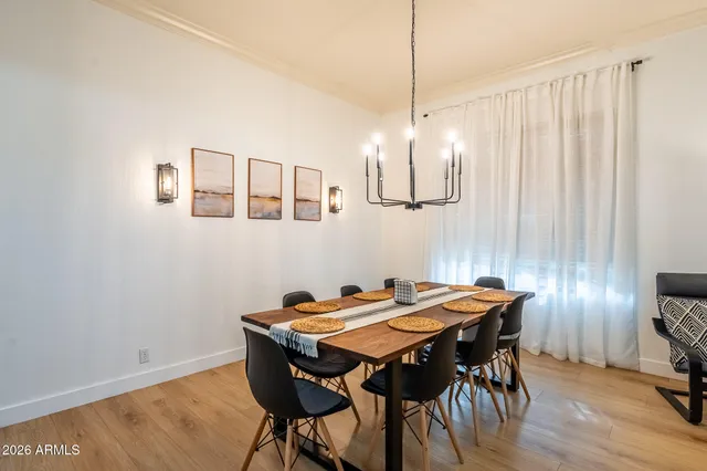 a living room with furniture and a book shelf