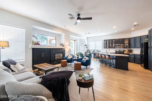 a kitchen with stainless steel appliances a stove a sink dishwasher and cabinets with wooden floor