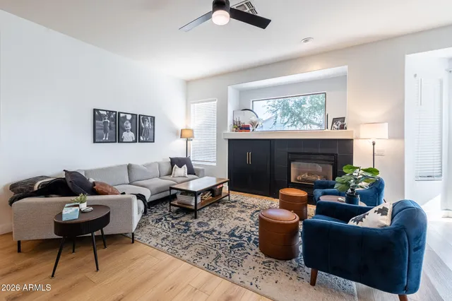 a kitchen with kitchen island a sink a stove a dining table and chairs