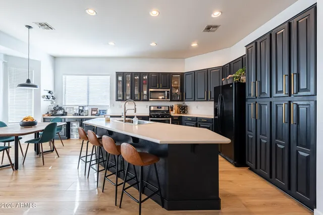 a view of a backyard with plants and patio