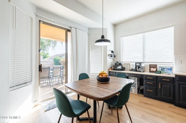 a en suite bathroom with a granite countertop sink and a mirror