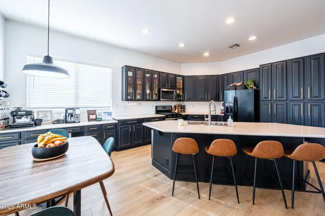 a view of a house with swimming pool and sitting area