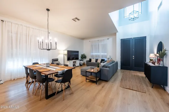 a view of a dining room with furniture and wooden floor