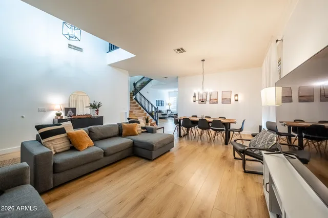 a view of a hallway with wooden floor and entryway