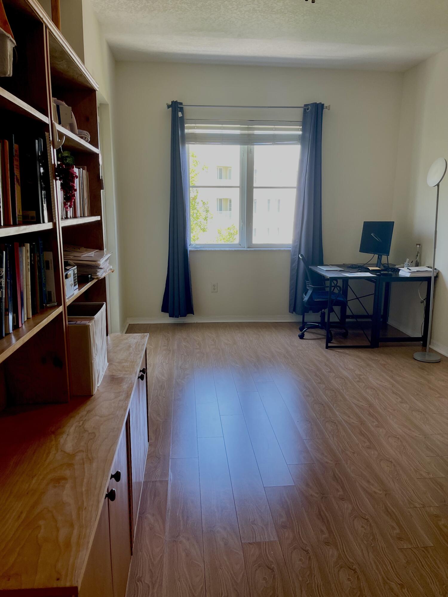 1209 Main Street, Unit 307 Jupiter, FL 33458 - Photo 3 of 15 Bookcase/Privacy wall in Living Room