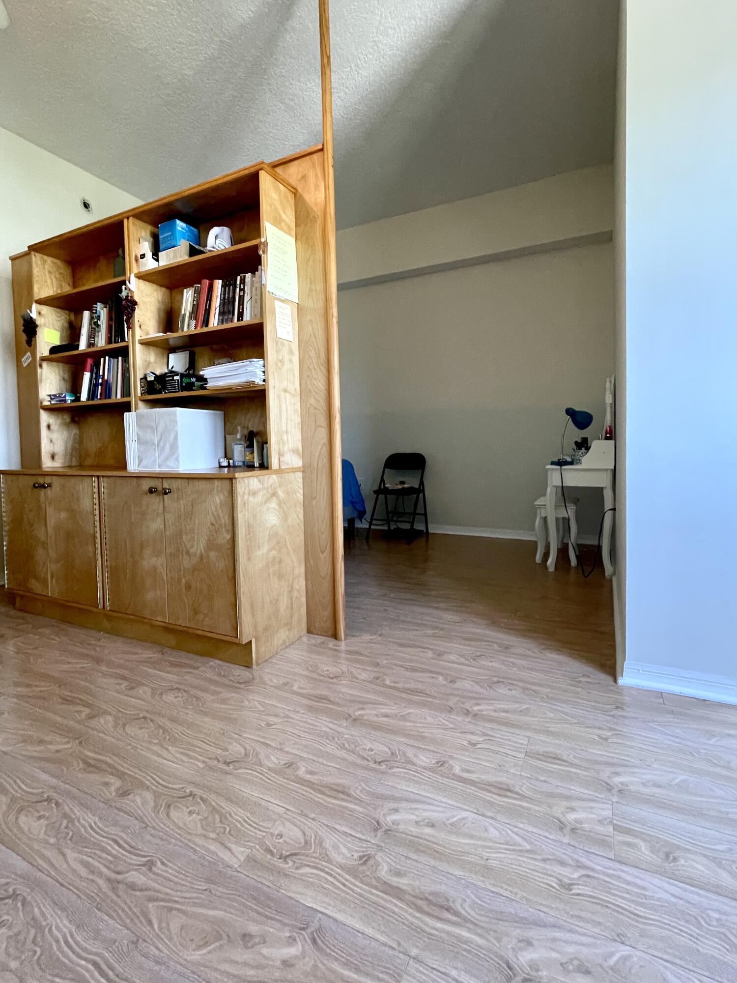 1209 Main Street, Unit 307 Jupiter, FL 33458 - Photo 4 of 15 Bookcase creates semi-private Bedroom
