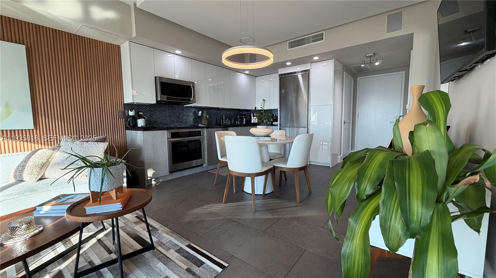 92 Southwest 3rd Street, Unit 3607 Miami, FL 33130 - Photo 11 of 33 a living room with furniture a large window and stainless steel appliances