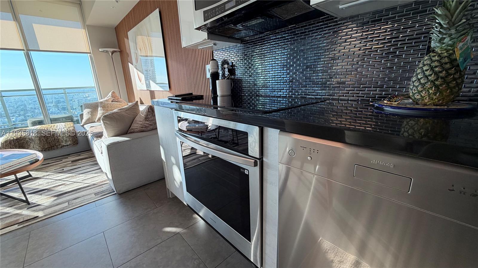 92 Southwest 3rd Street, Unit 3607 Miami, FL 33130 - Photo 14 of 33 a kitchen with a sink and a stove