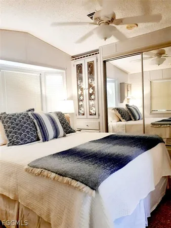 a bedroom with a large bed and a couch