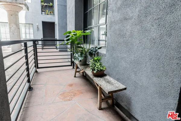 a view of a balcony with chairs