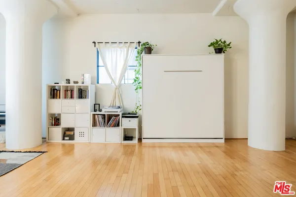 a view of kitchen with furniture and wooden floor