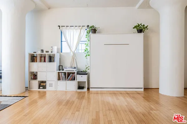 a view of kitchen with furniture and wooden floor