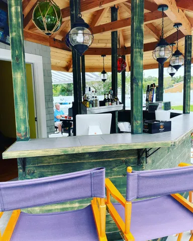 a view of swimming pool with a bench in front of building