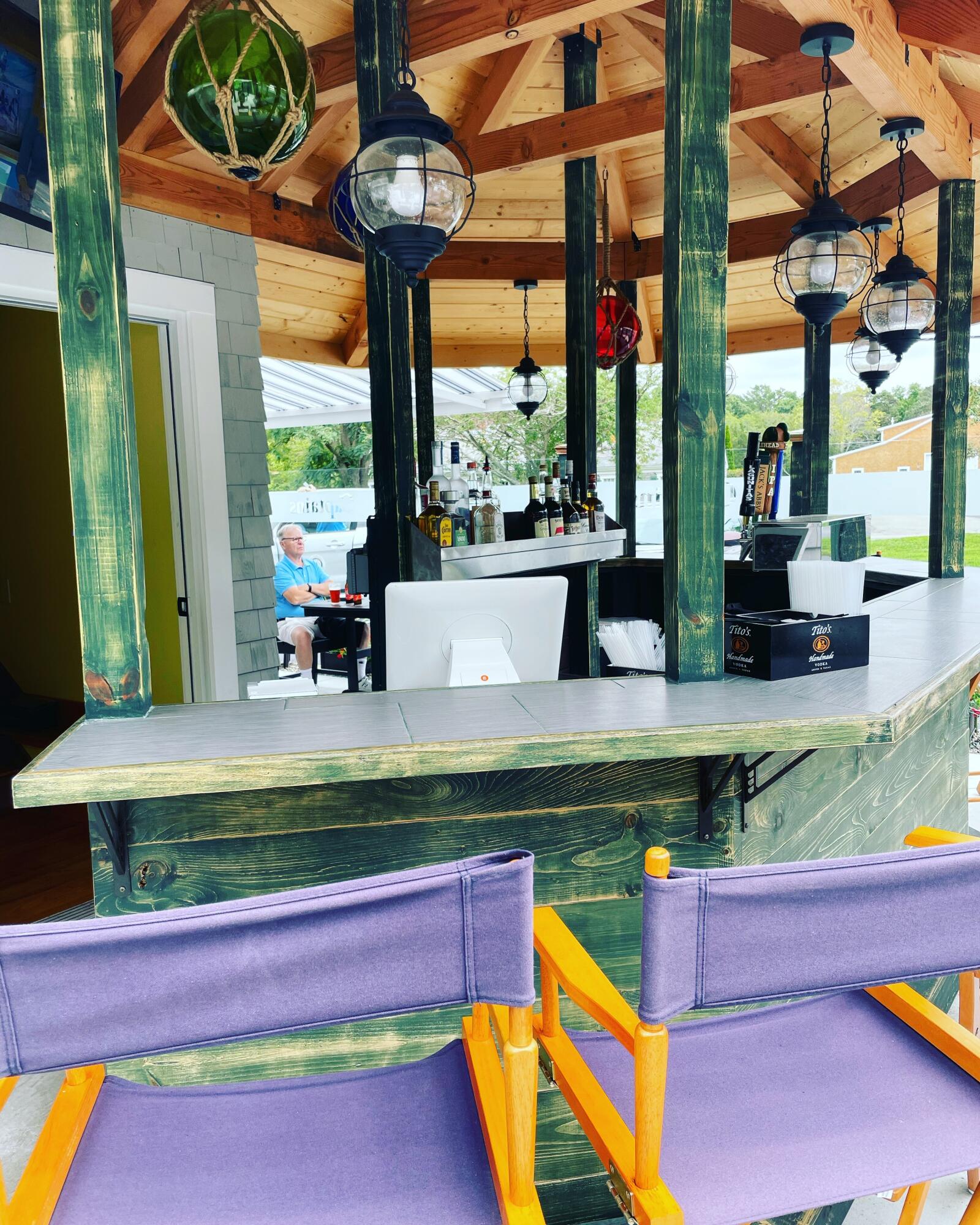 a view of swimming pool with a bench in front of building