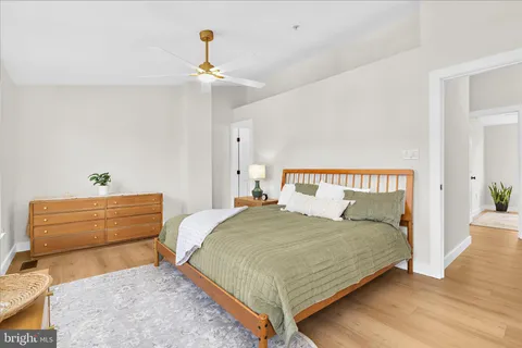 a bedroom with a bed and a dresser