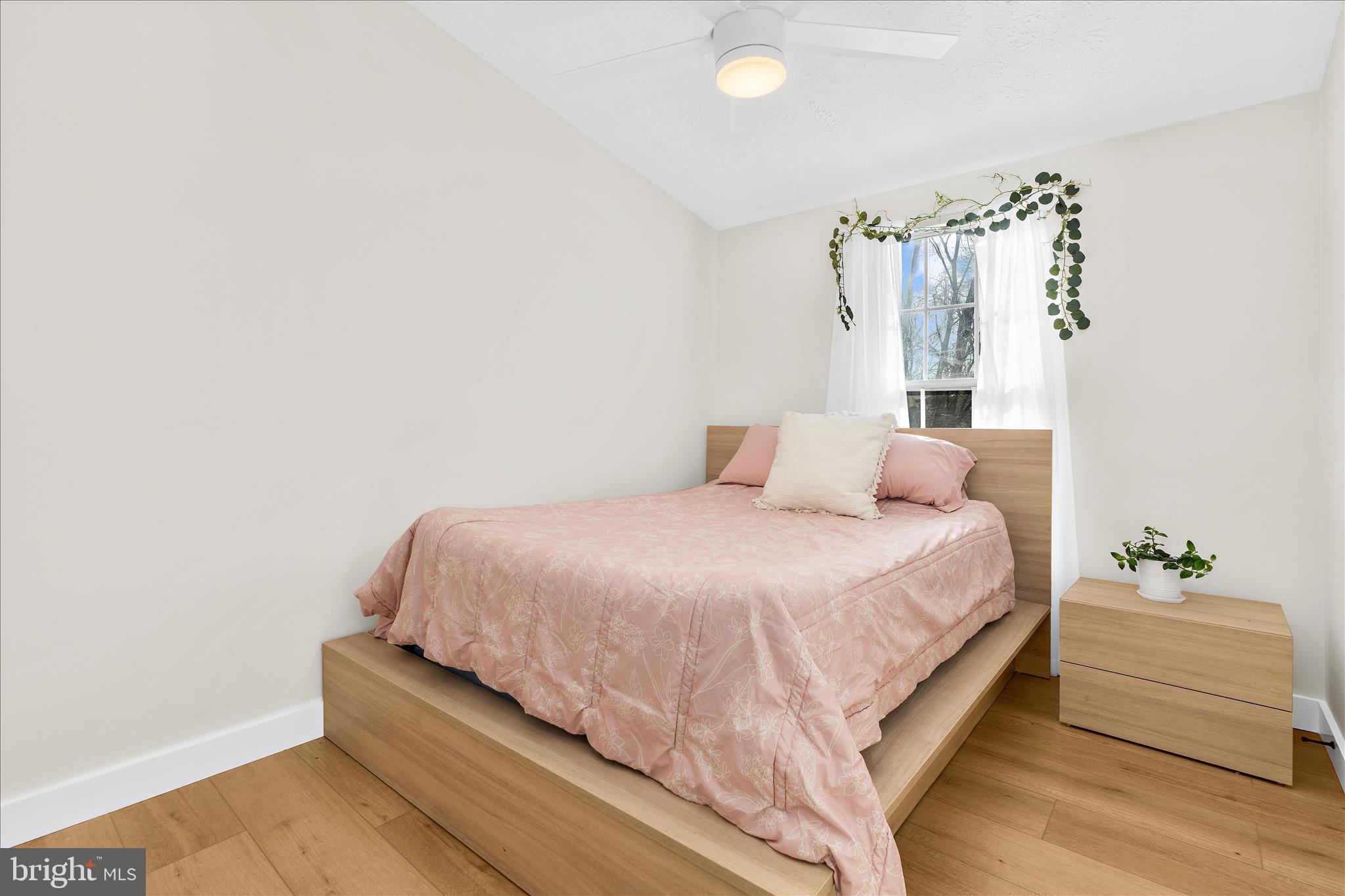 1530 Falstone Lane Crofton, MD 21114 - Photo 29 of 53 a bedroom with a bed and a night stand