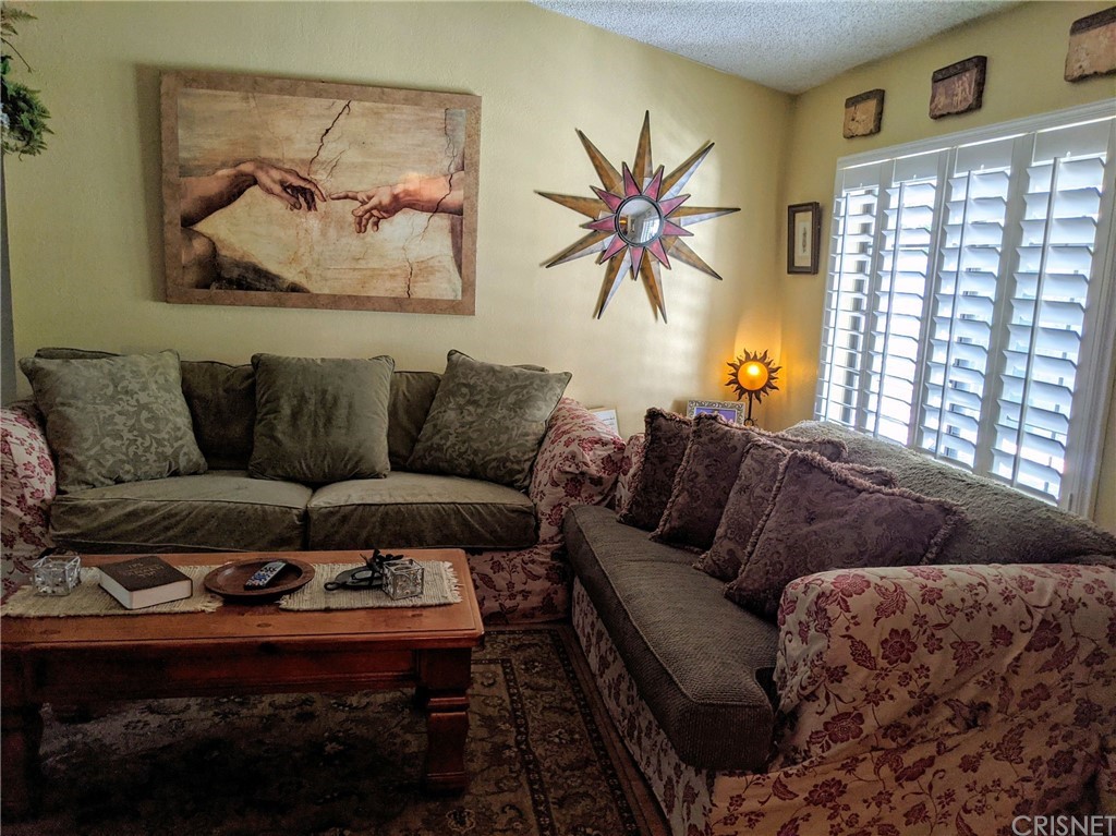29043 Paradise Road Val Verde, CA 91384 - Photo 14 of 23 a living room with furniture and a window