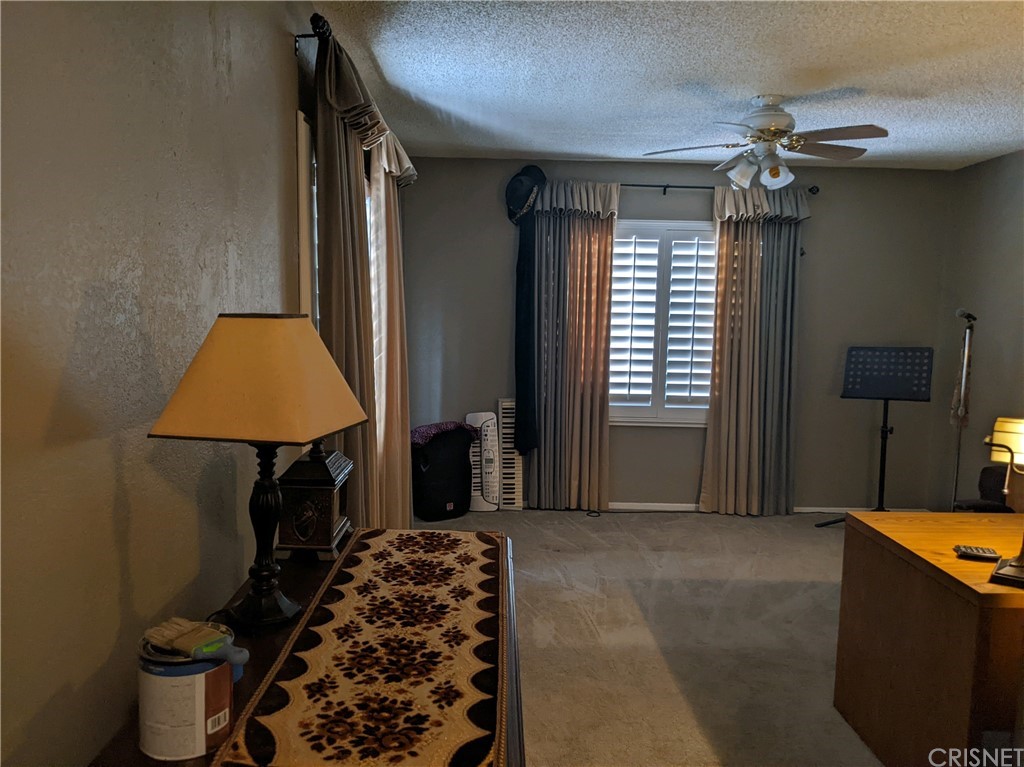 29043 Paradise Road Val Verde, CA 91384 - Photo 18 of 23 a bedroom with a bed and a window