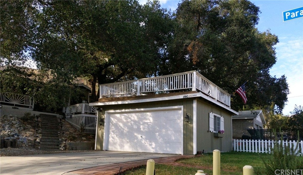 29043 Paradise Road Val Verde, CA 91384 - Photo 2 of 23 a view of a house with a balcony